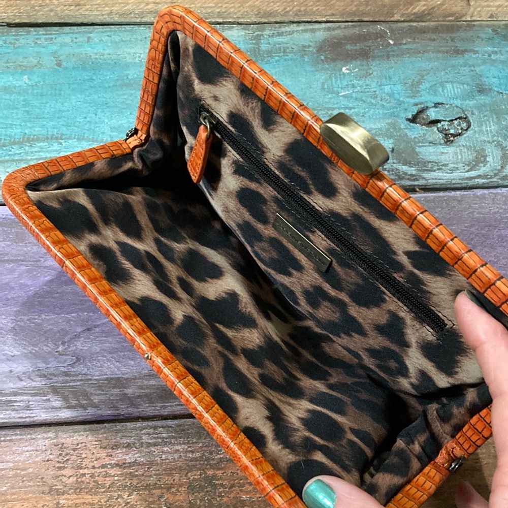 Orange sueded clutch